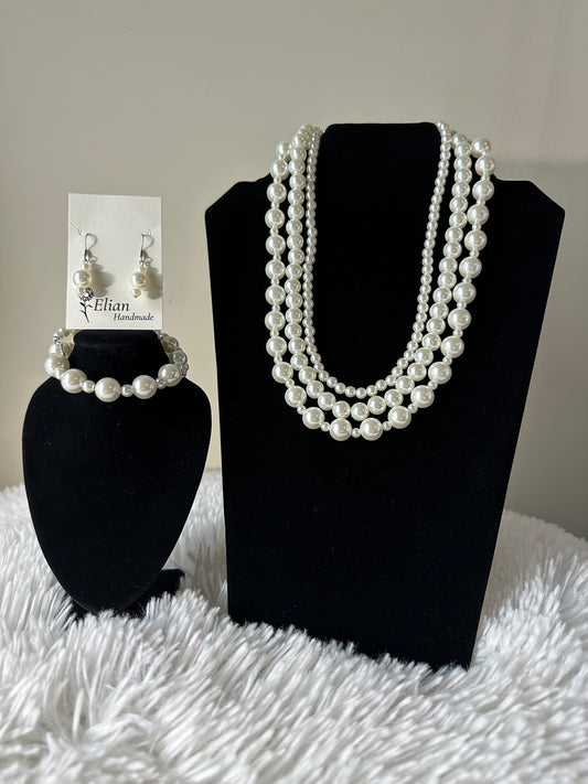 Wedding Cake Glass pearl 3 layer handmade jewelry set. It includes 20 inch necklace, bracelet, and earrings.